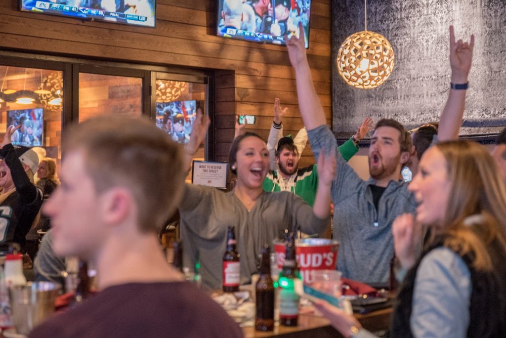 Fans celebrate a big win at Bobby V's Stamford